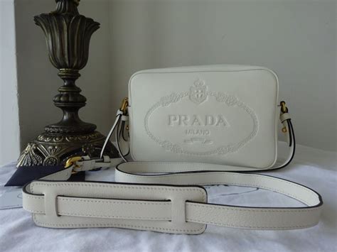 prada embossed logo crossbody|The Symbole .